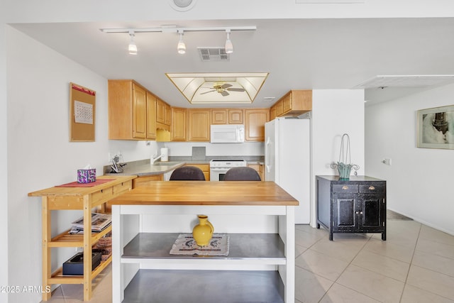 kitchen with light tile patterned floors, white appliances, wooden counters, ceiling fan, and light brown cabinetry