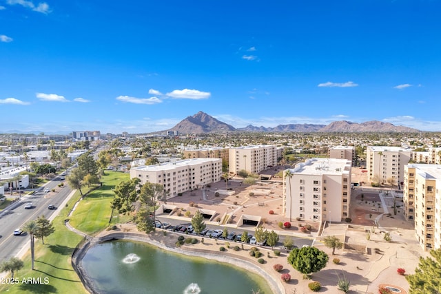 bird's eye view with a water and mountain view