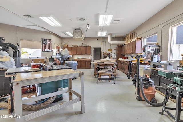 miscellaneous room featuring a workshop area