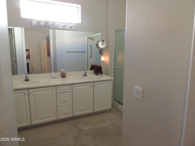 15104 W Pinehurst Ln W, Surprise, AZ 85374 - full bathroom featuring a textured wall, a sink, a shower stall, and double vanity