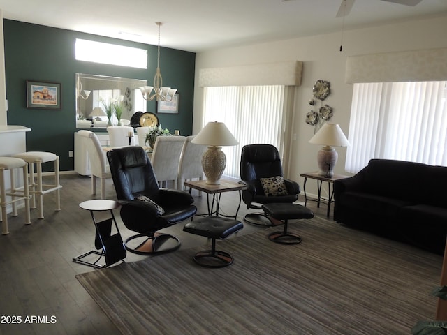 15104 W Pinehurst Ln W, Surprise, AZ 85374 - living area with plenty of natural light, dark wood finished floors, and ceiling fan with notable chandelier