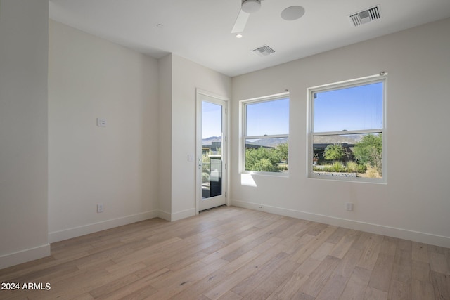 spare room featuring light hardwood / wood-style flooring