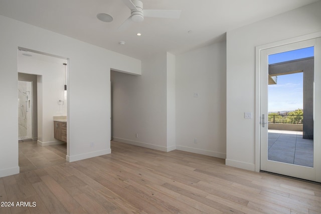 interior space with ceiling fan and light hardwood / wood-style flooring