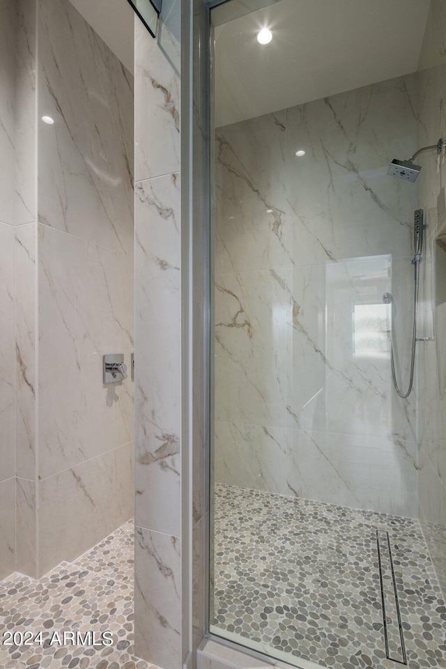 bathroom with a tile shower