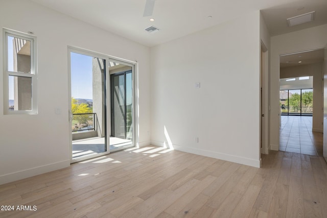 spare room with light wood-type flooring