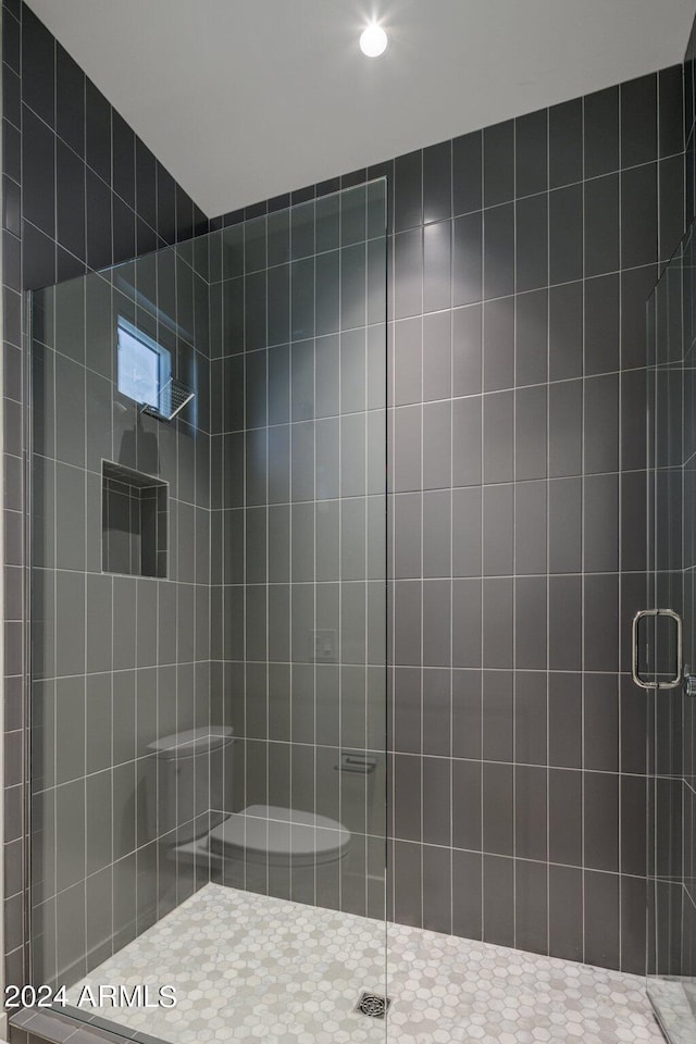 bathroom featuring an enclosed shower