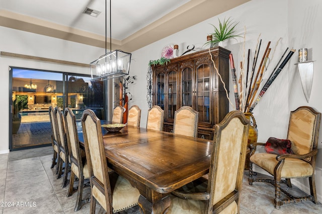 dining area featuring an inviting chandelier