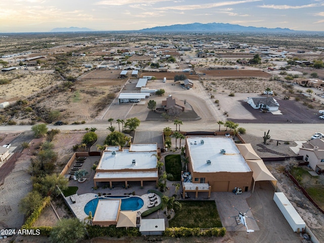 birds eye view of property with a mountain view