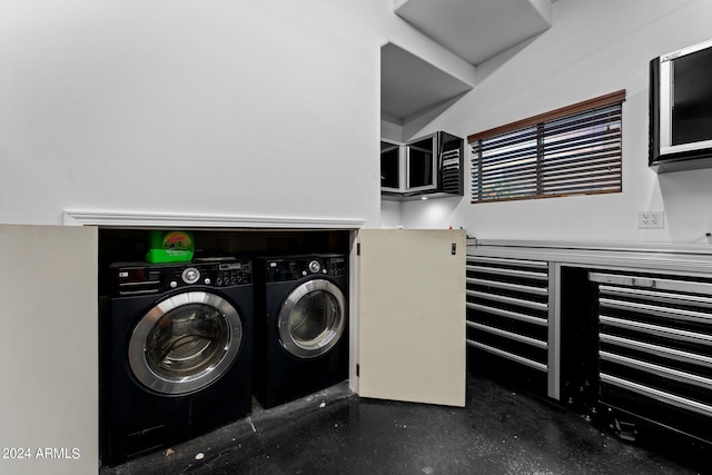 clothes washing area featuring independent washer and dryer