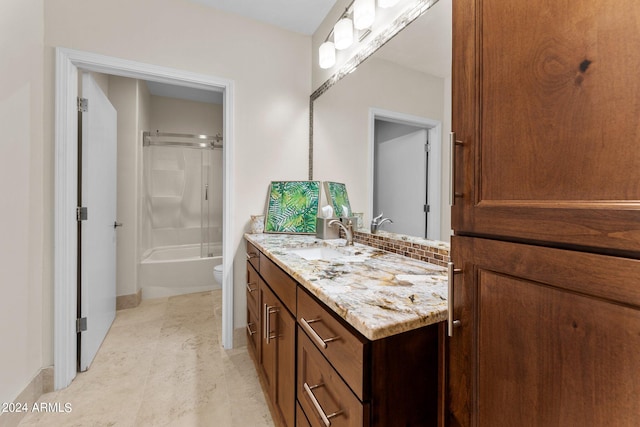 full bathroom with bath / shower combo with glass door, vanity, hardwood / wood-style floors, and toilet