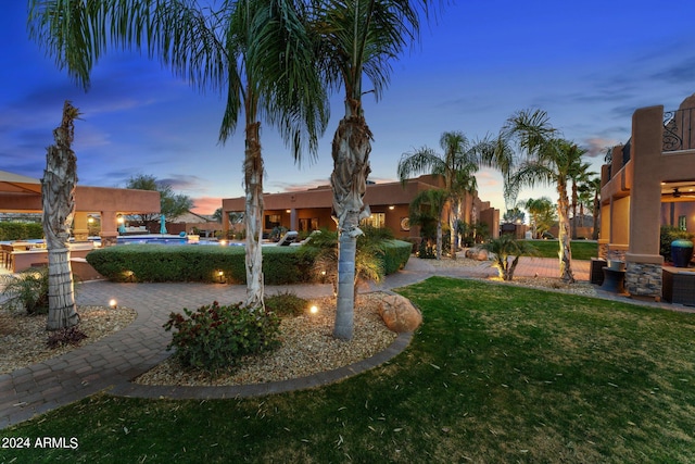 exterior space with a lawn and a patio