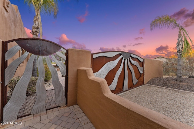 view of patio terrace at dusk