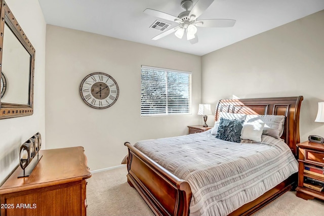 bedroom with visible vents, light colored carpet, a ceiling fan, and baseboards