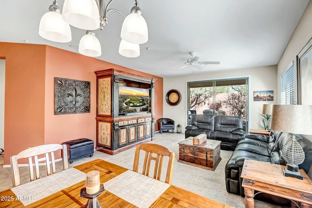 dining area featuring baseboards and ceiling fan