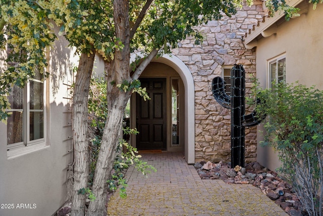 3917 E Patrick Ln, Phoenix, AZ 85050 - view of exterior entry with stone siding and stucco siding