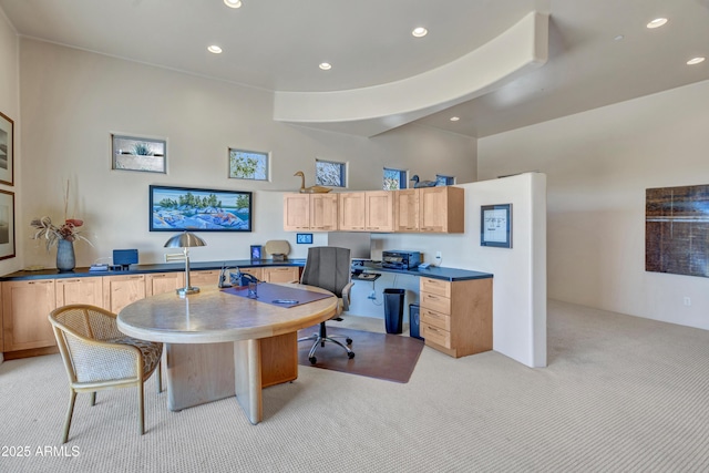 carpeted office with built in desk