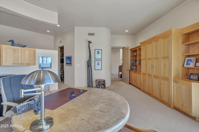 dining room featuring light carpet