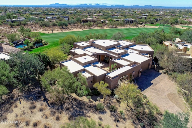 birds eye view of property with a mountain view