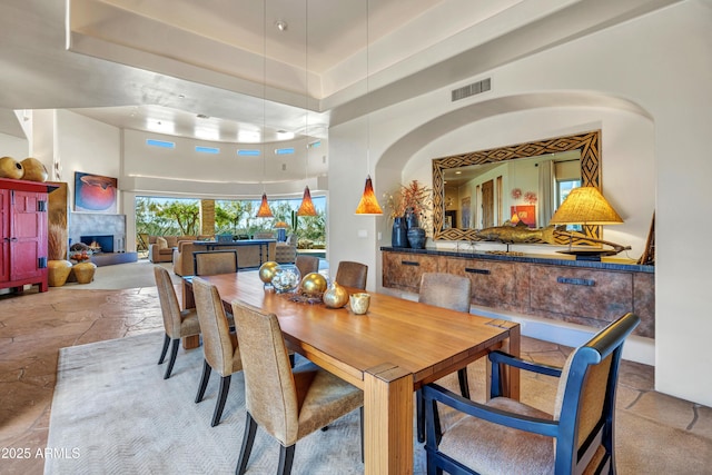 dining room featuring a high ceiling