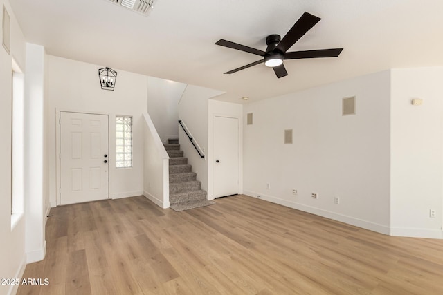 2112 S 160th Dr, Goodyear, AZ 85338 - foyer entrance featuring ceiling fan, light wood finished floors, and stairway