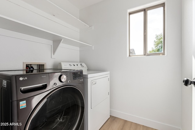 2112 S 160th Dr, Goodyear, AZ 85338 - washroom featuring washing machine and dryer and light wood finished floors