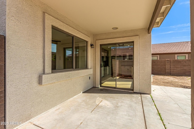 2112 S 160th Dr, Goodyear, AZ 85338 - view of exterior entry with a patio area and stucco siding
