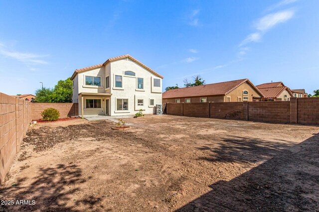 2112 S 160th Dr, Goodyear, AZ 85338 - rear view of house featuring a fenced backyard, stucco siding, and a tile roof