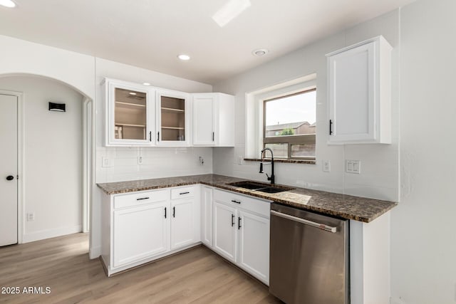 2112 S 160th Dr, Goodyear, AZ 85338 - kitchen with dishwasher, dark stone counters, light wood finished floors, backsplash, and recessed lighting