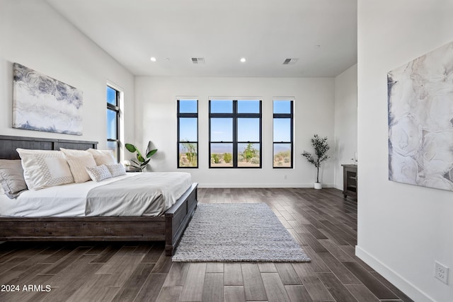 bedroom featuring dark hardwood / wood-style flooring