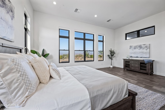 bedroom featuring dark hardwood / wood-style flooring