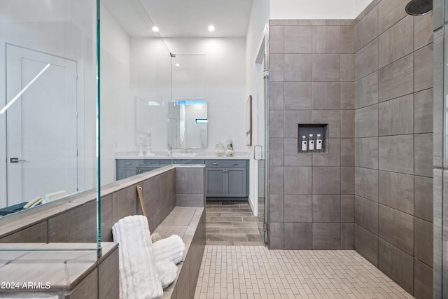 bathroom featuring vanity and an enclosed shower