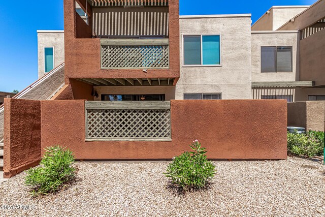 rear view of house with a balcony