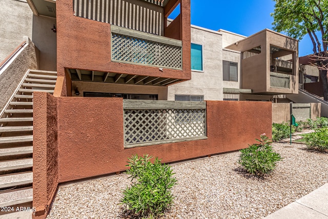 view of side of home with a balcony