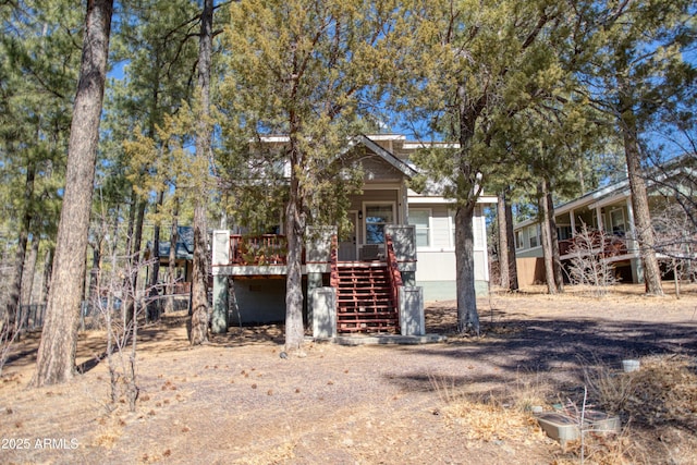 view of front of home featuring stairs