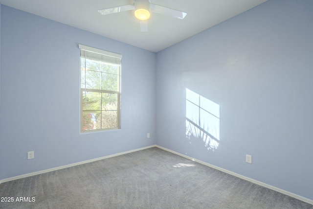 spare room with ceiling fan and carpet floors