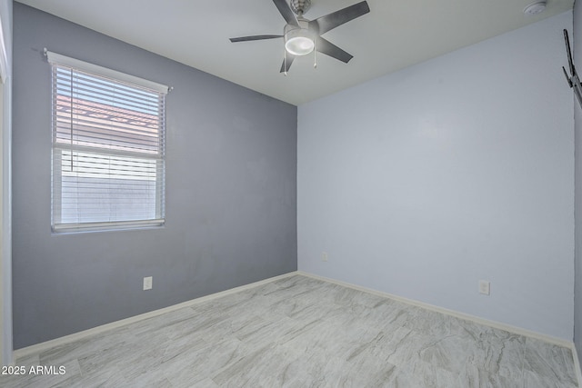 spare room featuring ceiling fan