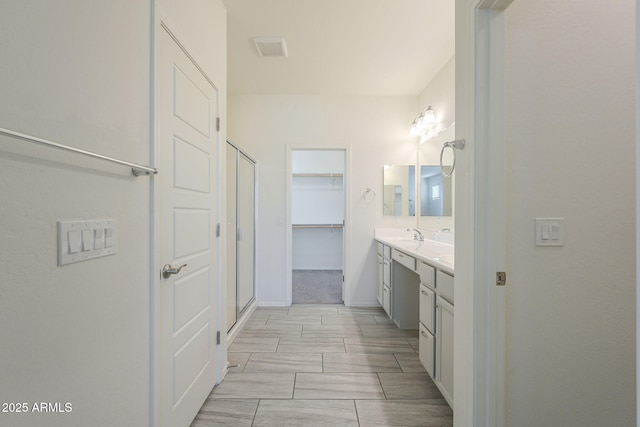 bathroom featuring vanity and walk in shower