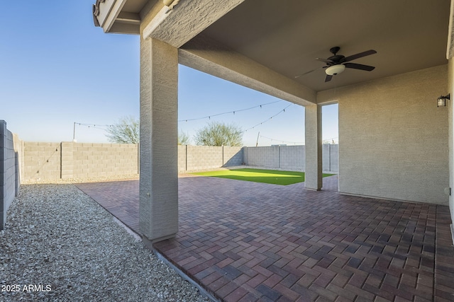 view of patio / terrace featuring ceiling fan