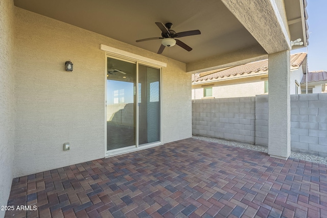 view of patio featuring ceiling fan