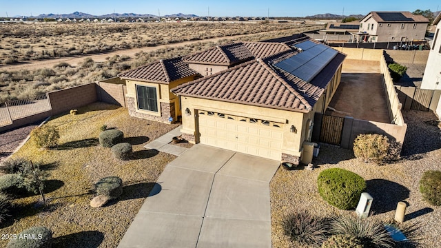 birds eye view of property featuring a mountain view