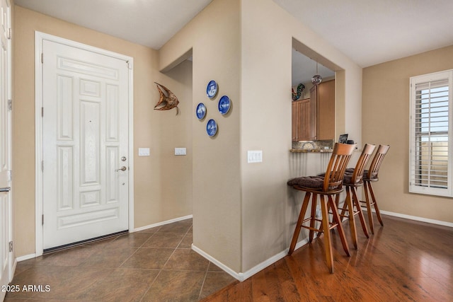 entryway featuring dark wood-type flooring