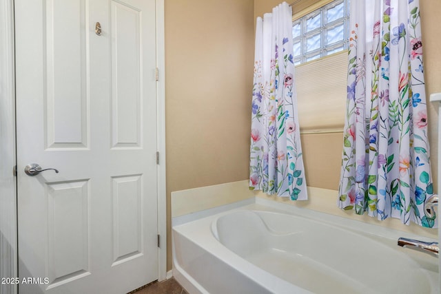 bathroom with a washtub