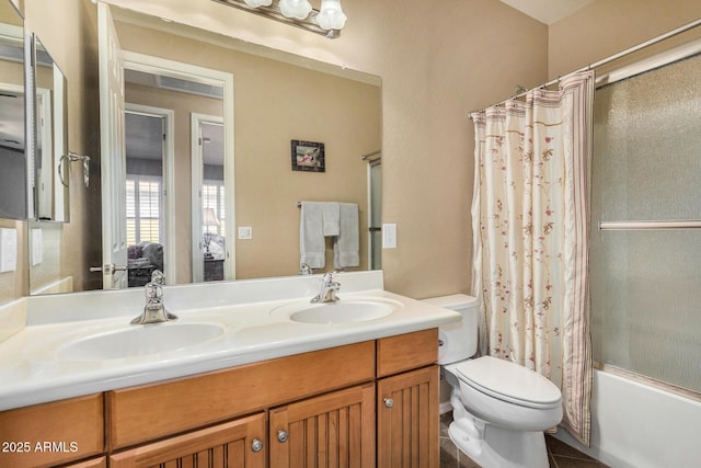 full bathroom featuring toilet, shower / bath combination with curtain, and vanity