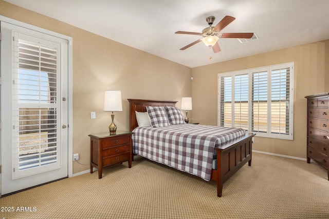 bedroom with access to outside, light colored carpet, and ceiling fan