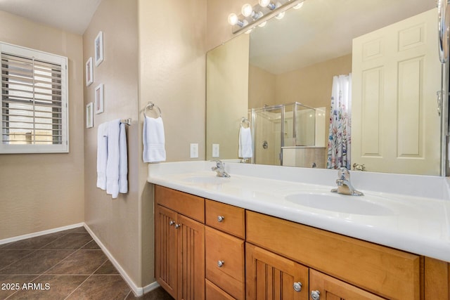 bathroom with vanity, tile patterned floors, and a shower with shower door