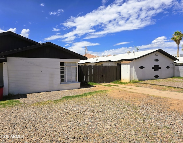 1432 S Stanley Pl, Tempe, AZ 85281 - view of home's exterior featuring fence and an outdoor structure