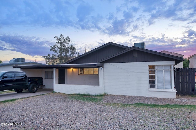 1432 S Stanley Pl, Tempe, AZ 85281 - property exterior at dusk featuring brick siding and fence
