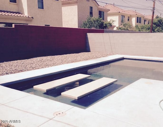1432 S Stanley Pl, Tempe, AZ 85281 - view of pool with a fenced backyard, a diving board, and a fenced in pool