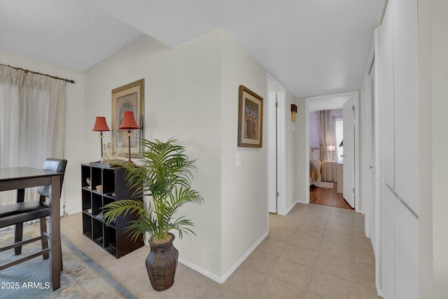 hallway with light tile patterned floors