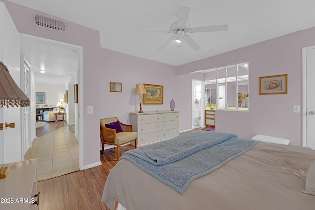 bedroom with wood-type flooring and ceiling fan